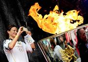 6 June 2012; Irish Olympian & 5000m silver medallist Sonia O'Sullivan takes a photo of the cauldron after she ignited it with the Olympic Flame during the London 2012 Olympic Torch Relay. St. Stephen's Green, Dublin. Picture credit: Brian Lawless / SPORTSFILE