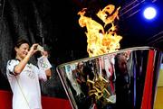 6 June 2012; Irish Olympian & 5000m silver medallist Sonia O'Sullivan takes a photo of the cauldron after she ignited it with the Olympic Flame during the London 2012 Olympic Torch Relay. St. Stephen's Green, Dublin. Picture credit: Brian Lawless / SPORTSFILE