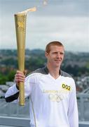 6 June 2012; Kilkenny hurler and 10 time hurling All-Star Henry Shefflin on the Etihad Skyline at Croke Park with the Olympic Flame during the London 2012 Olympic Torch Relay through the streets of Dublin. Croke Park, Dublin. Picture credit: Brendan Moran / SPORTSFILE