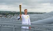 6 June 2012; Kilkenny hurler and 10 time hurling All-Star Henry Shefflin on the Etihad Skyline at Croke Park with the Olympic Flame during the London 2012 Olympic Torch Relay through the streets of Dublin. Croke Park, Dublin. Picture credit: Brendan Moran / SPORTSFILE