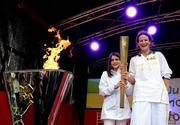 6 June 2012; Irish Olympian & 5000m silver medallist Sonia O'Sullivan and her daughter Sophie, age 10, after lighting the cauldron with the Olympic Flame during the London 2012 Olympic Torch Relay. St. Stephen's Green, Dublin. Picture credit: Brian Lawless / SPORTSFILE