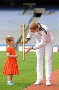 6 June 2012; Kilkenny hurler and 10 time hurling All-Star Henry Shefflin with his daughter Sadhbh, age 4, at Croke Park, after his leg as a torchbearer carrying the Olympic Flame during the London 2012 Olympic Torch Relay through the streets of Dublin. Croke Park, Dublin. Picture credit: Brendan Moran / SPORTSFILE