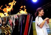 6 June 2012; Irish Olympian & 5000m silver medallist Sonia O'Sullivan after lighting the cauldron with the Olympic Flame during the London 2012 Olympic Torch Relay. St. Stephen's Green, Dublin. Picture credit: Brian Lawless / SPORTSFILE