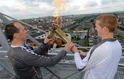 6 June 2012; Kilkenny hurler and 10 time hurling All-Star Henry Shefflin has his torch re-lit on the Etihad Skyline at Croke Park with the Olympic Flame during the London 2012 Olympic Torch Relay through the streets of Dublin. Croke Park, Dublin. Picture credit: Brendan Moran / SPORTSFILE