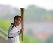 6 June 2012; Kilkenny hurler and 10 time hurling All-Star Henry Shefflin at Croke Park with the Olympic Flame during the London 2012 Olympic Torch Relay through the streets of Dublin. Croke Park, Dublin. Picture credit: Barry Cregg / SPORTSFILE