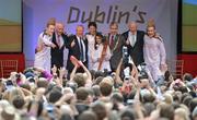 6 June 2012; Irish Olympian & 5000m silver medallist Sonia O'Sullivan and her daughter Sophie, age 10, with, from left, John, Fine Gael T.D for Kerry North Jimmy Deenihan, Minister of State for Tourism & Sport Michael Ring T.D, Lord Mayor of Dublin Cllr. Andrew Montague, Pat Hickey, President of the Olympic Council of Ireland, and Jedward, after lighting the cauldron with the Olympic Flame during the London 2012 Olympic Torch Relay. St. Stephen's Green, Dublin. Picture credit: Diarmuid Greene / SPORTSFILE