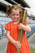 6 June 2012; Sadhbh Shefflin, age 4, daughter of Kilkenny hurler and 10 time hurling All-Star Henry Shefflin, with her father's Olympic Torch after his leg of the London 2012 Olympic Torch Relay through the streets of Dublin. Croke Park, Dublin. Picture credit: Brendan Moran / SPORTSFILE
