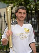 6 June 2012; Dublin footballer Bernard Brogan with the Olympic Flame during the London 2012 Olympic Torch Relay through the streets of Dublin. Mansion House, Dawson Street, Dublin. Picture credit: Barry Cregg / SPORTSFILE