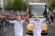 6 June 2012; Torchbearers John, left, and Edward Grimes, aka Jedward, are identical twins and are widely known for their blonde quiffs. The twins first appeared as John & Edward on The X Factor 2009, generating a phenomenon described as “the Jedward Paradox”. Both young men have competed very successfully in schools athletics and recently completed the Los Angeles marathon. They represented Ireland at the Eurovision Song Contest 2011 and will do so again in 2012, with the Olympic Flame during the London 2012 Olympic Torch Relay through the streets of Dublin. O'Connell Street, Dublin. Picture credit: Ray McManus / SPORTSFILE