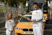 6 June 2012; Torchbearer Áine Holden hands over to Shane Horgan, who recently retired through injury from rugby football following a superb career as a centre and winger that included 65 caps for Ireland, being part of three Triple Crown winning sides and gaining a British and Irish Lions tour spot. Now a media pundit, he is one of the most popular figures in Irish sport and a legend in Leinster rugby, where he racked up 207 caps for his province including a European Cup victory. Nominated by the IRFU  with the Olympic Flame during the London 2012 Olympic Torch Relay through the streets of Dublin. Picture credit: Ray McManus / SPORTSFILE