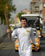 6 June 2012; Torchbearer Shane Horgan, who recently retired through injury from rugby football following a superb career as a centre and winger that included 65 caps for Ireland, being part of three Triple Crown winning sides and gaining a British and Irish Lions tour spot. Now a media pundit, he is one of the most popular figures in Irish sport and a legend in Leinster rugby, where he racked up 207 caps for his province including a European Cup victory, with the Olympic Flame during the London 2012 Olympic Torch Relay through the streets of Dublin. Custom House Quay, Dublin. Picture credit: Ray McManus / SPORTSFILE