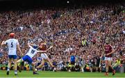 3 September 2017; Jason Flynn of Galway scores a point despite the efforts of Kieran Bennett of Waterford during the GAA Hurling All-Ireland Senior Championship Final match between Galway and Waterford at Croke Park in Dublin. Photo by Sam Barnes/Sportsfile