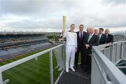 6 June 2012; Kilkenny hurler and 10 time hurling All-Star Henry Shefflin on the Etihad Skyline at Croke Park carrying the Olympic Flame, with from left, Leo Varadkar, T.D., Minister for Transport, Tourism and Sport, Sir Craig Reedie, Executive Board Member of the International Olympic Committee, Pat Hickey, President of the Olympic Council of Ireland, Peter McKenna, Stadium Director, Croke Park and Commercial Director of the GAA, Lord Sebastian Coe, Chairman of London 2012 Olympic Games and Paralympic Games, and Uachtarán Chumann Lúthchleas Gael Liam Ó Néill, during the London 2012 Olympic Torch Relay through the streets of Dublin. Croke Park, Dublin. Picture credit: Brendan Moran / SPORTSFILE