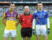 3 June 2012; Wexford captain Graeme Molloy, left, and Longford captain Paul Barden with referee Michael Collins before the game. Leinster GAA Football Senior Championship Quarter-Final, Longford v Wexford, Croke Park, Dublin. Photo by Sportsfile