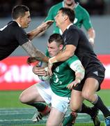 9 June 2012; Cian Healy, Ireland, is tackled by Sonny Bill Williams, left, and Dan Carter, New Zealand. Steinlager Series 2012, 1st Test, New Zealand v Ireland, Eden Park, Auckland, New Zealand. Picture credit: Ross Setford / SPORTSFILE