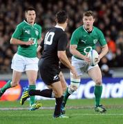 9 June 2012; Brian O'Driscoll, Ireland, with support from team-mate Jonathan Sexton, in action against Dan Carter, New Zealand. Steinlager Series 2012, 1st Test, New Zealand v Ireland, Eden Park, Auckland, New Zealand. Picture credit: Ross Setford / SPORTSFILE