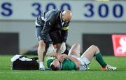 9 June 2012; Ireland's Cian Healy is attended to by team doctor Dr. Eanna Falvey after sustaining an injury during the game. Steinlager Series 2012, 1st Test, New Zealand v Ireland, Eden Park, Auckland, New Zealand. Picture credit: Ross Setford / SPORTSFILE