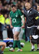 9 June 2012; Ireland's Cian Healy leaves the fireld alongside team doctor Dr. Eanna Falvey after sustaining an injury during the game. Steinlager Series 2012, 1st Test, New Zealand v Ireland, Eden Park, Auckland, New Zealand. Picture credit: Ross Setford / SPORTSFILE