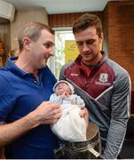 4 September 2017; Galway captain David Burke with Donie Hourigan and Daniel, 3 weeks, from Terryglass, Co. Tipperary, during the All-Ireland Hurling Champions visit to Our Lady's Children's Hospital in Crumlin, Dublin. Photo by Piaras Ó Mídheach/Sportsfile