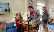 4 September 2017; Tom Breheny, age 9, from Chapelizod in Dublin, meets Galway captain David Burke during the All-Ireland Hurling Champions visit to Our Lady's Children's Hospital in Crumlin, Dublin. Photo by Piaras Ó Mídheach/Sportsfile