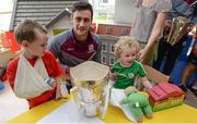 4 September 2017; Galway captain David Burke with Martin Cummins, age 5, from Kildare, left, and James Dillon, age 4, from Dundrum in Dublin, during the All-Ireland Hurling Champions visit to Our Lady's Children's Hospital in Crumlin, Dublin. Photo by Piaras Ó Mídheach/Sportsfile