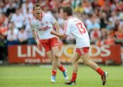 10 June 2012; Mark Bradley, Tyrone, celebrates with team-mate Sean Hackett, left, after scoring his side's second goal. Electric Ireland Ulster GAA Football Minor Championship, Quarter-Final, Armagh v Tyrone, Morgan Athletic Grounds, Armagh. Picture credit: Brian Lawless / SPORTSFILE
