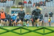 3 June 2012; Conor Tierney, left, aged 8, alonside Dublin captain Bryan Cullen leads the Dublin team out on to the pitch. Leinster GAA Football Senior Championship Quarter-Final, Louth v Dublin, Croke Park, Dublin. Photo by Sportsfile