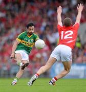 10 June 2012; Paul Galvin, Kerry, shoots to score a point during the second half despite the attempted block from Patrick Kelly, Cork.  Munster GAA Football Senior Championship, Semi-Final, Cork v Kerry, Pairc Ui Chaoimh, Cork. Picture credit: Diarmuid Greene / SPORTSFILE