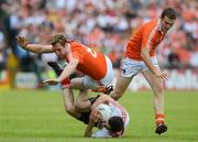 10 June 2012; Colm Cavanagh, Tyrone, in action against Kieran Toner and Brendan Donaghy, Armagh. Ulster GAA Football Senior Championship, Quarter-Final, Armagh v Tyrone, Morgan Athletic Grounds, Armagh. Picture credit: Brian Lawless / SPORTSFILE