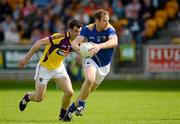 10 June 2012; Brian Kavanagh, Longford, in action against Graeme Molloy, Wexford. Leinster GAA Football Senior Championship, Quarter-Final Replay, Longford v Wexford, O'Connor Park, Tullamore, Co. Offaly. Picture credit: Barry Cregg / SPORTSFILE