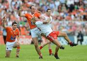 10 June 2012; Owen Mulligan, Tyrone, in action against Malachy Mackin and Brian Mallon, left, Armagh. Ulster GAA Football Senior Championship, Quarter-Final, Armagh v Tyrone, Morgan Athletic Grounds, Armagh. Picture credit: Brian Lawless / SPORTSFILE