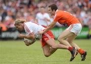 10 June 2012; Owen Mulligan, Tyrone, in action against Brendan Donaghy, Armagh. Ulster GAA Football Senior Championship, Quarter-Final, Armagh v Tyrone, Morgan Athletic Grounds, Armagh. Picture credit: Brian Lawless / SPORTSFILE
