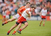 10 June 2012; Mark Donnelly, Tyrone  in action against Brendan Donaghy, Armagh. Ulster GAA Football Senior Championship, Quarter-Final, Armagh v Tyrone, Morgan Athletic Grounds, Armagh. Picture credit: Oliver McVeigh / SPORTSFILE