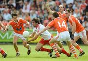 10 June 2012; Joe McMahon, Tyrone, in action against, from left, Jamie Clarke, Brian Mallon, Malachy Mackin, and Gavin McParland, Armagh. Ulster GAA Football Senior Championship, Quarter-Final, Armagh v Tyrone, Morgan Athletic Grounds, Armagh. Picture credit: Brian Lawless / SPORTSFILE