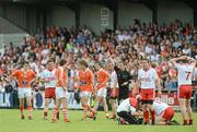 10 June 2012; Referee Joe McQuillan shows Armagh's Kevin Dyas, fourth from left, the red card. Ulster GAA Football Senior Championship, Quarter-Final, Armagh v Tyrone, Morgan Athletic Grounds, Armagh. Picture credit: Brian Lawless / SPORTSFILE