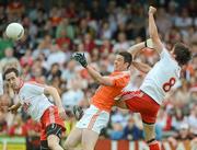10 June 2012; John Kingham, Armagh, in action against Colm Cavanagh, left, and Joe McMahon, Tyrone. Ulster GAA Football Senior Championship, Quarter-Final, Armagh v Tyrone, Morgan Athletic Grounds, Armagh. Picture credit: Brian Lawless / SPORTSFILE