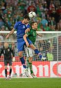 10 June 2012; Vedran Corluka, Croatia, in action against Kevin Doyle, Republic of Ireland. EURO2012, Group C, Republic of Ireland v Croatia, Municipal Stadium Poznan, Poznan, Poland. Photo by Sportsfile