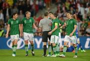 10 June 2012; Republic of Ireland players, from left to right, Keith Andrews, Richard Dunne, Stephen Ward, Robbie Keane and Kevin Doyle remonstrate with referee Björn Kuipers afterNikica Jelavic's scored the second goal for Croatia. EURO2012, Group C, Republic of Ireland v Croatia, Municipal Stadium Poznan, Poznan, Poland. Picture credit: David Maher / SPORTSFILE