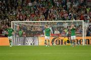 10 June 2012; Dejected Republic of Ireland players, from left, Sean St. Ledger, Stephen Ward and Aiden McGeady, after Mario Mandžukic, Croatia, scored his side's third goal after 48 minutes. EURO2012, Group C, Republic of Ireland v Croatia, Municipal Stadium Poznan, Poznan, Poland. Photo by Sportsfile