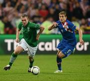 10 June 2012; Richard Dunne, Republic of Ireland, in action against Nikica Jelavic, Croatia. EURO2012, Group C, Republic of Ireland v Croatia, Municipal Stadium Poznan, Poznan, Poland. Picture credit: David Maher / SPORTSFILE