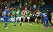 10 June 2012; Jonathan Walters, Republic of Ireland, helps apprehend a Croatian pitch invader during the final minutes of the game. EURO2012, Group C, Republic of Ireland v Croatia, Municipal Stadium Poznan, Poznan, Poland. Photo by Sportsfile