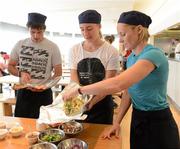 11 June 2012; Irish Olympic athletes, from left, Peter O'Leary, sailing, Natalya Coyle, modern pentathlon, and Derval O'Rourke, athletics, prepare for the Olympics by learning to prepare healthy food during a Wagamama 'Positive Eating' Cooking Class in Wagamama, Blanchardstown, Co. Dublin. Picture credit: Brendan Moran / SPORTSFILE
