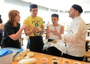 11 June 2012; Wagamama head chef Juan Mantaca, and Sharon Madigan, left, Nutritionist at the Irish Institute of Sport, speaking to Irish Olympic athletes, Eanna Bailey, modern pentathlon, and Caitriona Jennings, athletics, on how to prepare for the Olympics and Paralympics by learning to prepare healthy food during a Wagamama 'Positive Eating' Cooking Class in Wagamama, Blanchardstown, Co. Dublin. Picture credit: Brendan Moran / SPORTSFILE