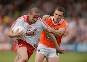 10 June 2012; Stephen O'Neill, Tyrone, in action against Brendan Donaghy, Armagh. Ulster GAA Football Senior Championship, Quarter-Final, Armagh v Tyrone, Morgan Athletic Grounds, Armagh. Picture credit: Oliver McVeigh / SPORTSFILE