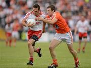10 June 2012; Mark Donnelly, Tyrone, in action against Brendan Rafferty, Armagh. Ulster GAA Football Senior Championship, Quarter-Final, Armagh v Tyrone, Morgan Athletic Grounds, Armagh. Picture credit: Oliver McVeigh / SPORTSFILE