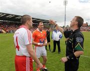 10 June 2012; Referee Joe McQuillan alongside Tyrone captain Stephen O'Neill, left, and Aramgh captain Ciaran McKeever during the coin toss. Ulster GAA Football Senior Championship, Quarter-Final, Armagh v Tyrone, Morgan Athletic Grounds, Armagh. Picture credit: Oliver McVeigh / SPORTSFILE