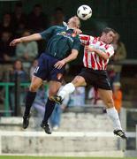 29 August 2002; Eddie McCallion of Derry City in action against Tony Bird of St Patrick's Athletic during the eircom League Premier Division match between Derry City and St Patrick's Athletic at Brandywell Stadium in Derry. Photo by David Maher/Sportsfile