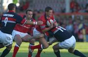 31 August 2002; Ronan O'Gara of Munster is tackled by Guy Easterby, left, and Stephen Jones of Llanelli during the Celtic League Pool A match between Llanelli and Munster at Stradey Park in Llanelli, Wales. Photo by Matt Browne/Sportsfile
