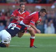 31 August 2002; Mossy Lawlor of Munster is tackled by Matt Cardey of Llanelli during the Celtic League Pool A match between Llanelli and Munster at Stradey Park in Llanelli, Wales. Photo by Matt Browne/Sportsfile