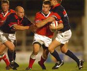 31 August 2002; Moeey Lawlor of Munster is tackled by Neil Boobyer, left, and Dwayne Peel of Llanelli during the Celtic League Pool A match between Llanelli and Munster at Stradey Park in Llanelli, Wales. Photo by Matt Browne/Sportsfile